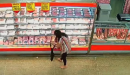 Mulher roubando carne